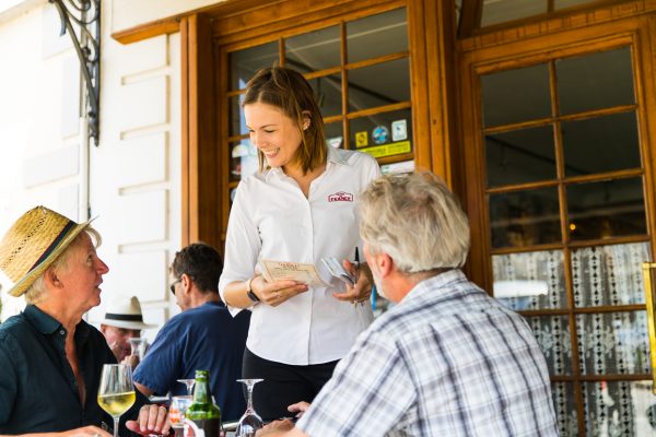 Hotel de France Terrace Bar informal eating male couple and waitress
